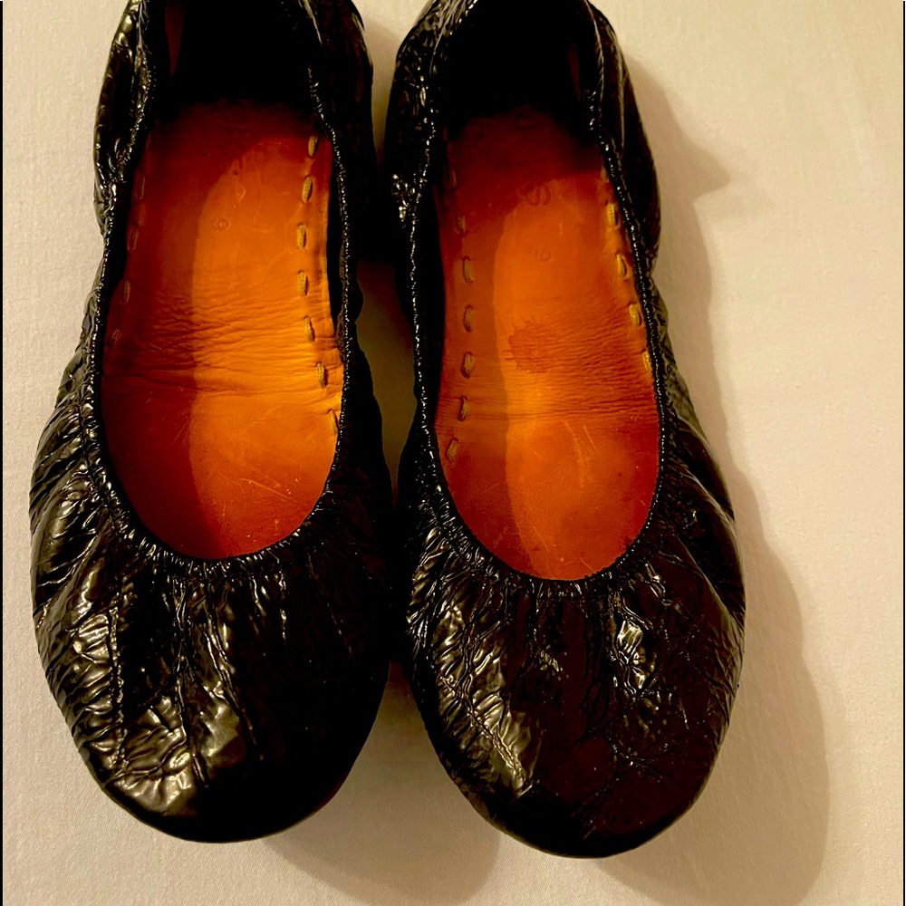 Tieks black embossed croc texture ballets flats.